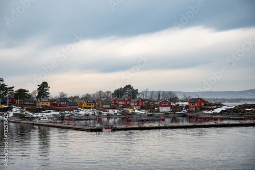 Traditional cottages on the islands around Oslo, Norway in winter. Islands with houses