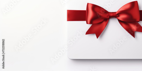 Gift card with a red bow and ribbon © Evon J