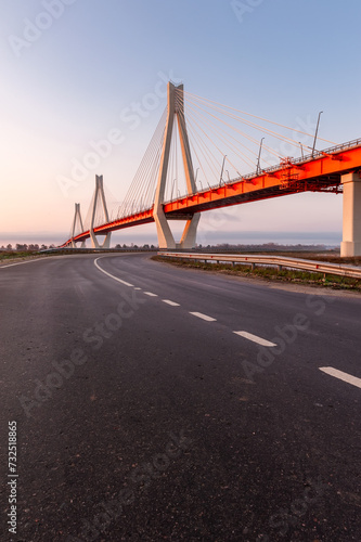 Cable-stayed bridge in the light of the morning sun and against the background of a clear blue sky. Murom. Russia.