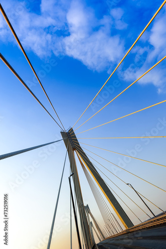 Cable-stayed bridge in the light of the morning sun and against the background of a clear blue sky. Murom. Russia.