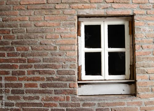 window of a brick house in the city