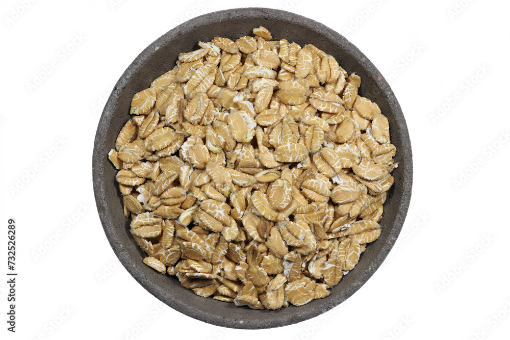 spelt flakes in a concrete bowl isolated on white background spelt flakes in a concrete bowl isolated on white background