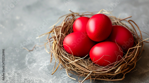 red easter eggs in a nest © Irina