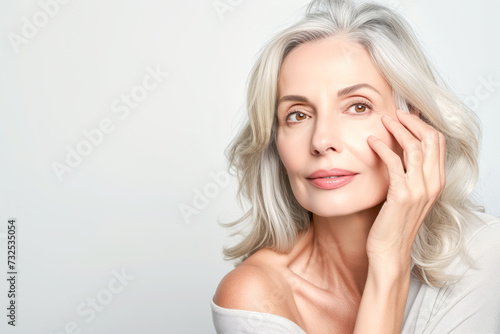 Beautiful 50s mid aged mature woman isolated on white background. skin care beauty  skincare cosmetics concept
