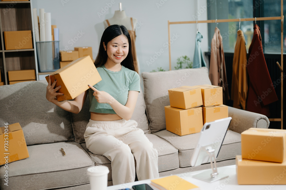 Small business entrepreneur SME freelance woman working at home office, BOX,tablet and laptop online, marketing, packaging, delivery Small business entrepreneur SME freelance woman working at home office, BOX,tablet and laptop online, marketing, packaging, delivery