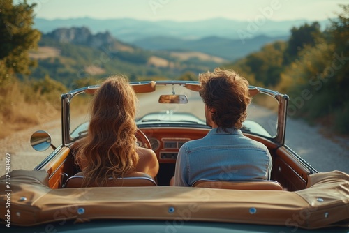 Man and Woman in Convertible Car photo