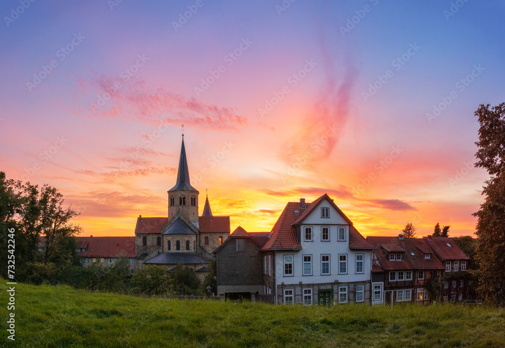 Colorful sunset in Hildesheim with a view of the St. Godehard Church, Lower Saxony, Germany