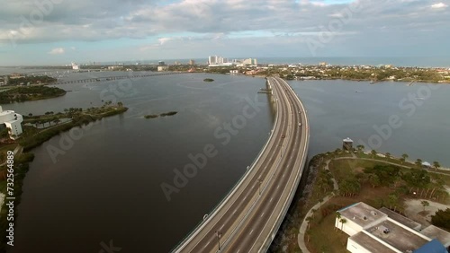 Wallpaper Mural Aerial Shot Of Cars Moving On Segmental Bridge Over River, Drone Flying Backwards Over City Landscape - Daytona Beach , Florida Torontodigital.ca