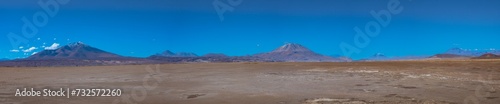 Huge deserted plains in the Salar de Chiguana surrounded by majestic volcanos, Potosi department, Bolivia photo