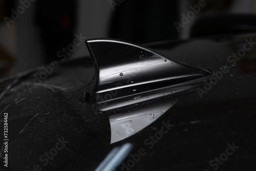 Shark fin car antenna. The radio antenna on the roof of the car. photo