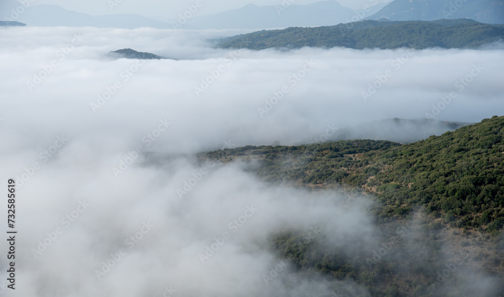 Mountain tops covered in a layer of mist and fog at dawn. Nature landscape Mountain tops covered in a layer of mist and fog at dawn. Nature landscape