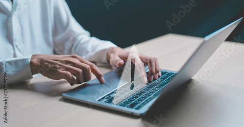 Obraz na plátně Businessman or programmer, developer using computer laptop with triangle caution warning sign for notification error and maintenance concept