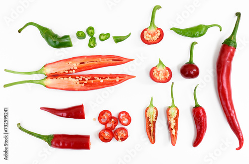 Hot chili peppers and cross section of long peppers. Small peppers, sliced peppers and different shapes of chili peppers