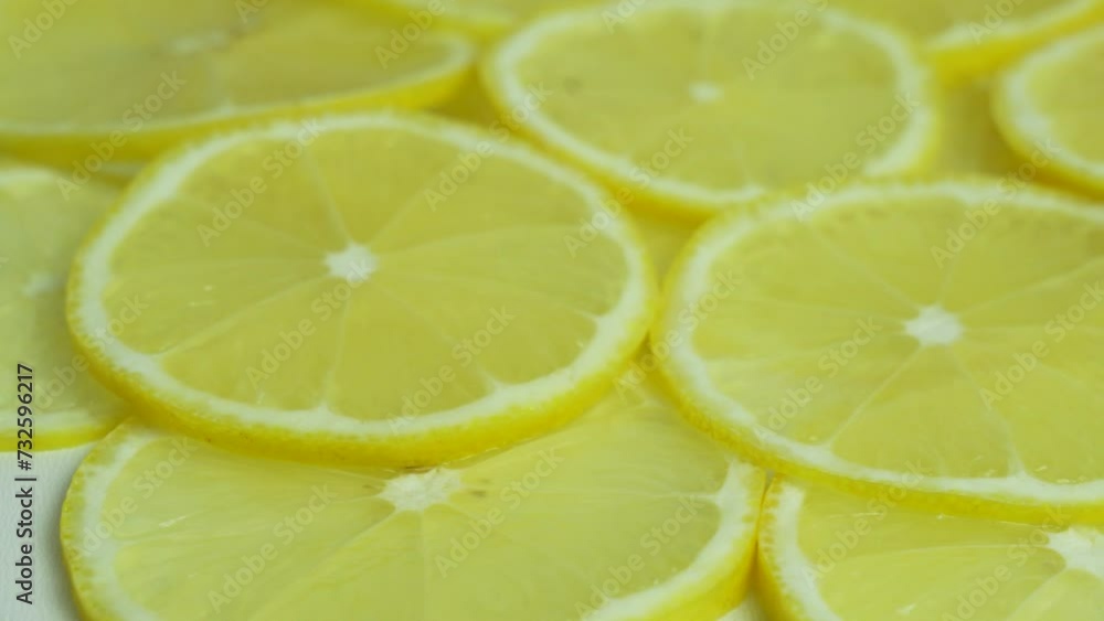 Juicy Lemon Slices, Macro. Sliced Lemon Pieces Rotate. Citrus Fruits, Isolated. Background from Lemons Lolek, Halves. Healthy Vegan Food and Vitamin C for the Immune System.