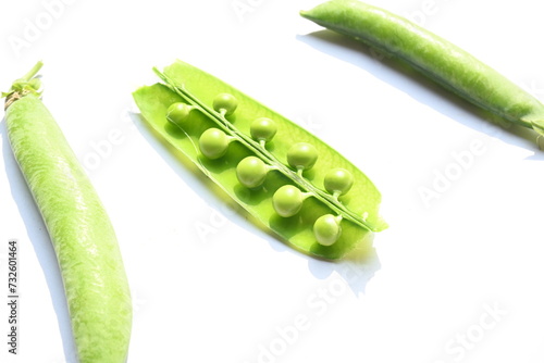 Fresh green pea on white background. There is a lot of vitamins and Minerals in it. The pea is most commonly the small spherical seed or the seed. Popular vegetable of all over world. 