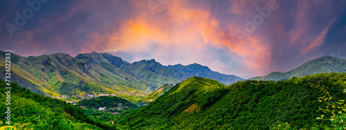 Amalfi Coast, Italy. Sunset on the green valley. View on the enchanting hills of the Lattari Mountains close to the Amalfi Coast. Banner header horizontal.