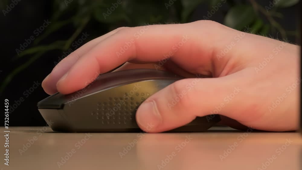 close-up of a hand on a computer mouse, macro photography when pressing a key on a computer mouse close-up of a hand on a computer mouse, macro photography when pressing a key on a computer mouse