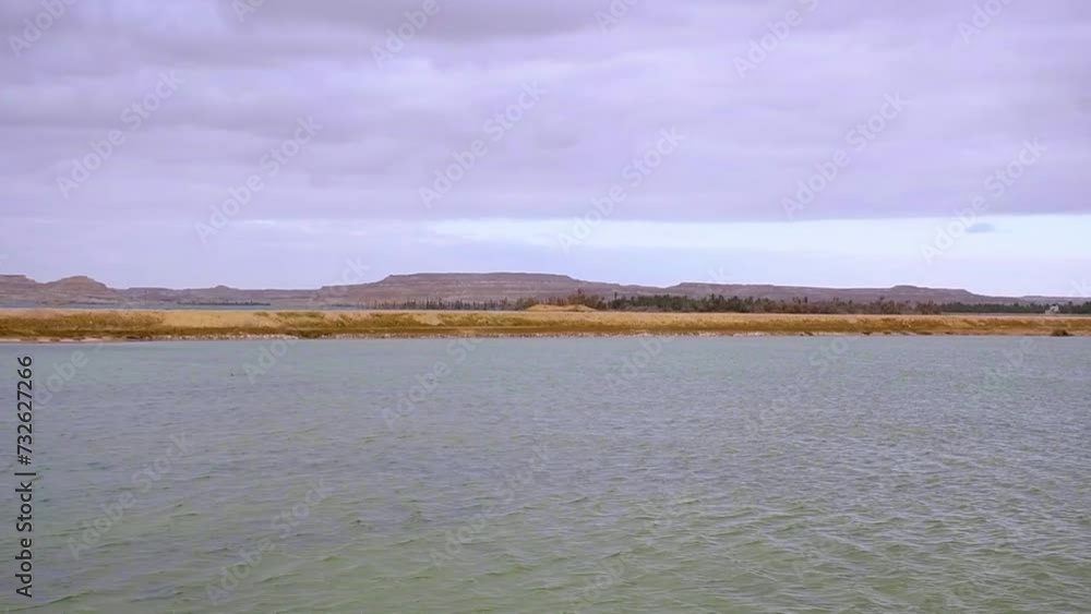 landscape with lake and clouds, water movement, desert place landscape with lake and clouds, water movement, desert place