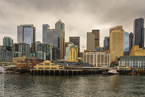 2023-12-31 THE CITY OF SEATTLE SKYLINE WITH A CLOUDY SKY FROM ELLIOTT BAY © Michael J Magee