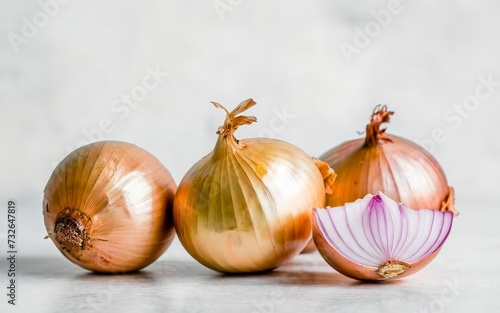 Ripe fresh golden onions on a white background
