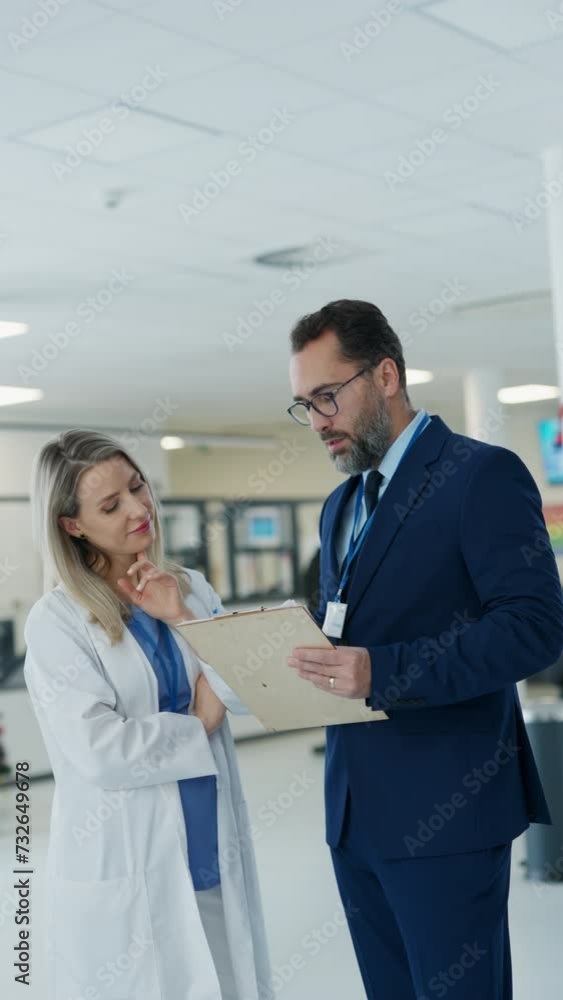 Pharmaceutical sales representative talking with doctor in medical building. Female doctor talking with hospital director, manager in private clinic. Pharmaceutical sales representative talking with doctor in medical building. Female doctor talking with hospital director, manager in private clinic.