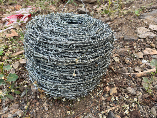 Barbed wire rolled in circle background.