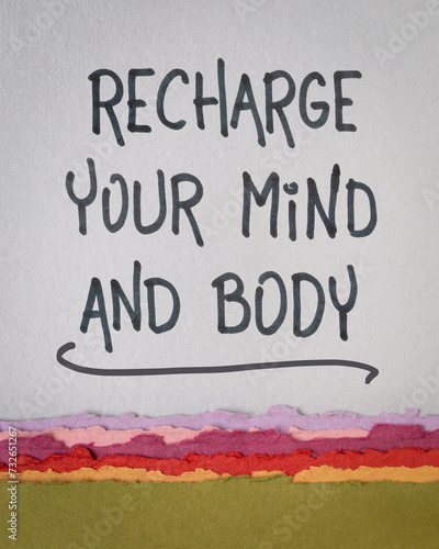 recharge your mind and body advice - inspiraitonal handwriting on art paper, vertical poster, well being, dealing with stress and fatigue, mental health and personal development concept photo