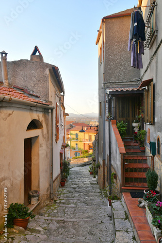 Fototapeta Naklejka Na Ścianę i Meble -  A narrow street in Riardo, a medieval village in Campania, Italy.