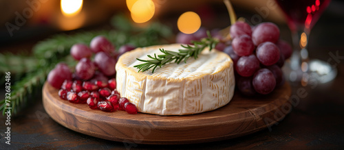 Brie  camembert cheese  grapes and pomegranate. Healthy food  appetizer  snack. 
