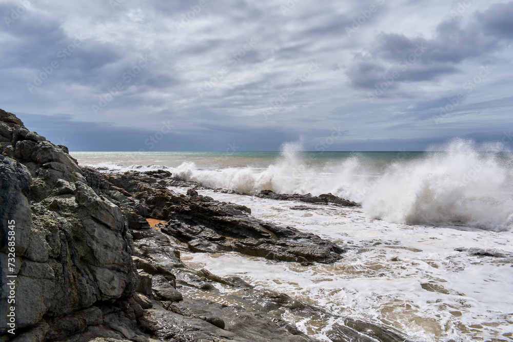 The angry Atlantic Ocean after a few days of the storm with cloudy water The angry Atlantic Ocean after a few days of the storm with cloudy water