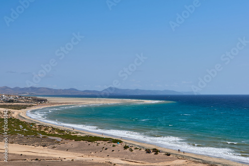 The Atlantic Ocean and Sotavento beach with clear sky and mountains in back © Ovidiu