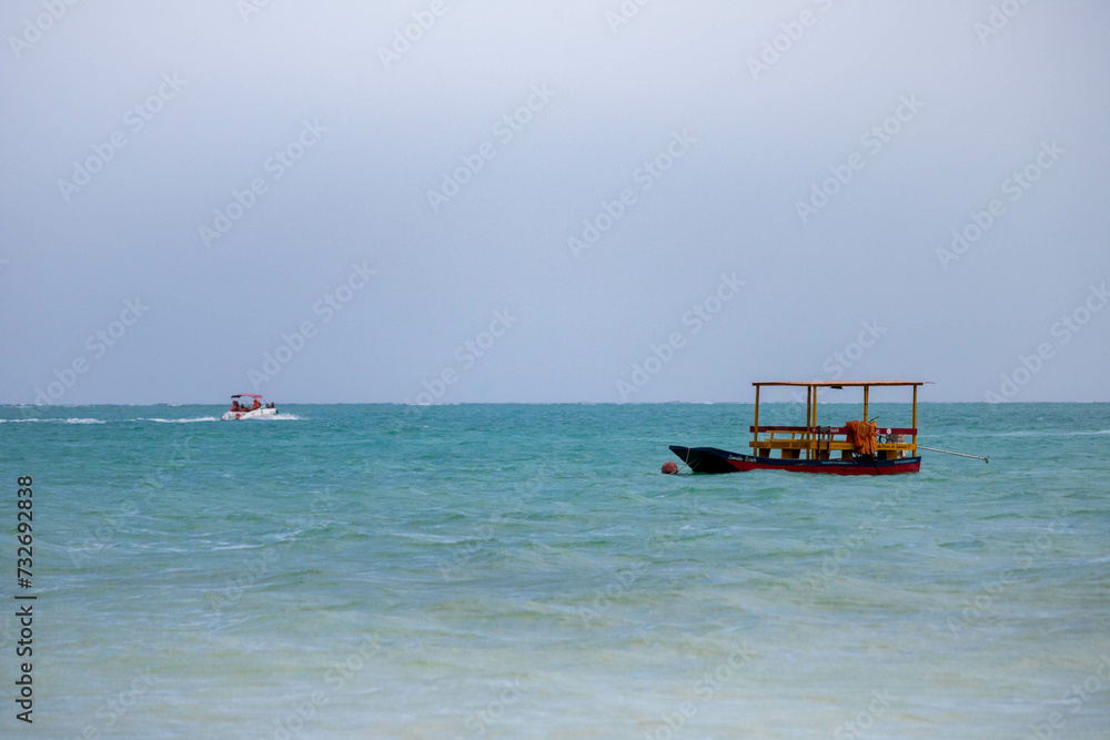 moment when a local fisherman's fishing boat collides with a pleasure boat. moment when a local fisherman's fishing boat collides with a pleasure boat.