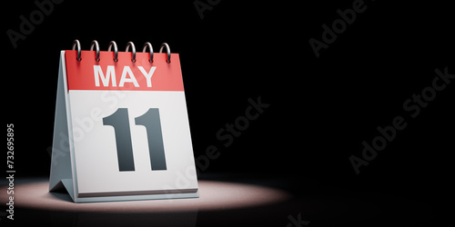 May 11 Calendar Spotlighted on Black Background