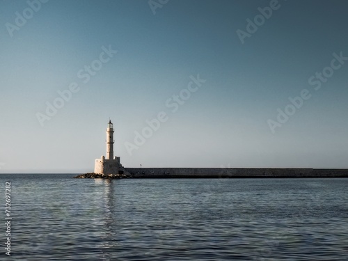 Lighthouse in the city of Chania in Crete, a beautiful bay overlooking the Mediterranean Sea. Beautiful sunrise and a spectacular lighthouse