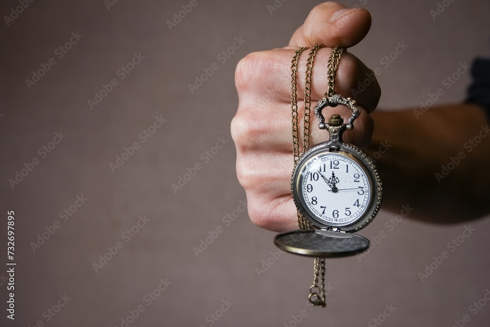a pocket watch in the hands of a man a pocket watch in the hands of a man