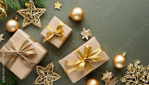 new year card with christmas gift boxes and golden decorations on khaki background