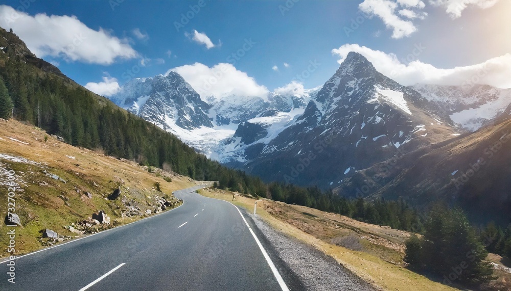 road leading to a snowcapped mountain premium image