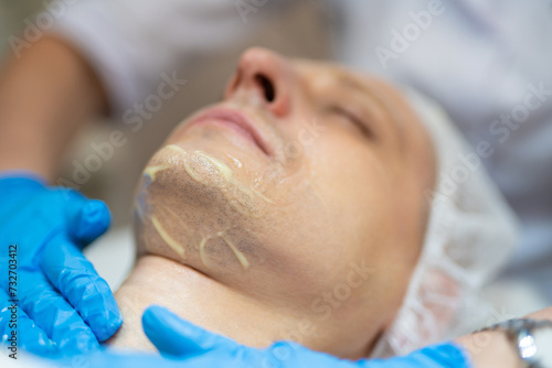 cosmetic procedures on a man's face in a beauty salon