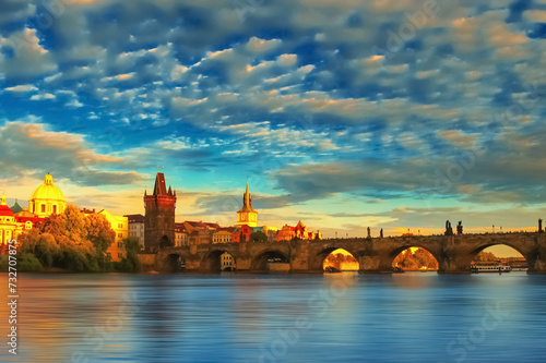 Scenic sunset of the Old Town pier architecture and Charles Bridge over Vltava river in Prague, Czech Republic. Horizontal image.