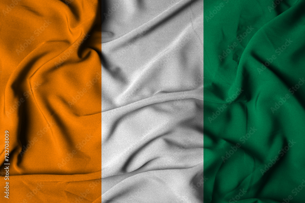 Selective focus of ivory coast flag, with waving fabric texture. 3d illustration Selective focus of ivory coast flag, with waving fabric texture. 3d illustration