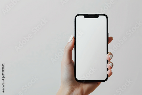 hand with great white nail design holds big phone with white screen flat view white background for website