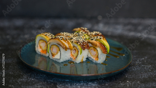 Sushi rolls are served on a plate. soy sauce. Delicious seafood food.