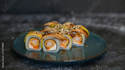 Sushi rolls are served on a plate. soy sauce. Delicious seafood food.