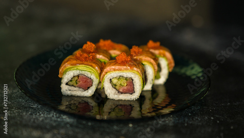 Sushi rolls are served on a plate. soy sauce. Delicious seafood food.