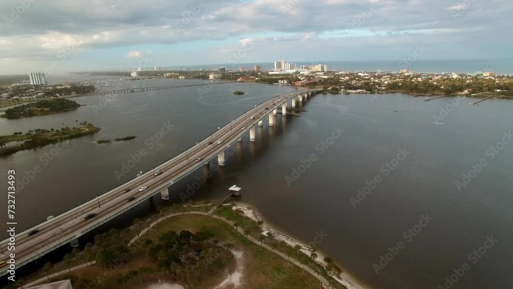 Aerial Panning Shot Of Broadway Bridge Over Halifax River Under Cloudy Sky - Daytona Beach , Florida Aerial Panning Shot Of Broadway Bridge Over Halifax River Under Cloudy Sky - Daytona Beach , Florida