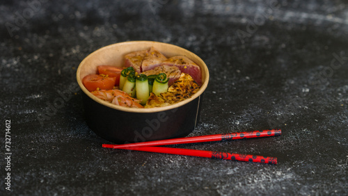 Seafood salad served on a beautiful plate. Salad with king prawns and prosciutto.