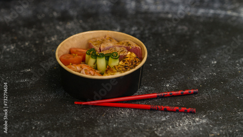 Seafood salad served on a beautiful plate. Salad with king prawns and prosciutto.