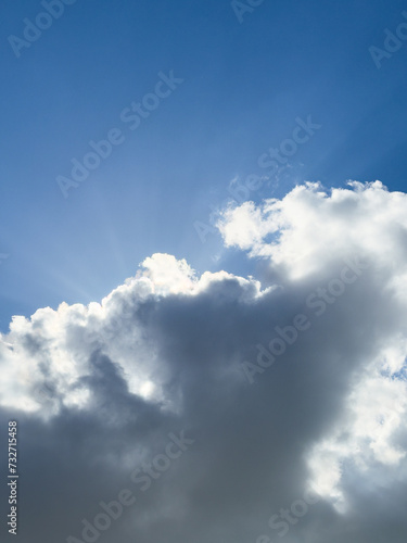 blue sky with clouds and sunlight © Charles Ellinwood