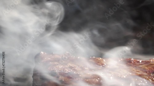 Close up of delicious beef steak on flaming grill. Barbecue grill. Cooking Health low cholesterol Lean Meat. photo