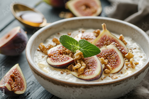 Bowl of Greek yogurt with honey- walnuts and sliced fig.